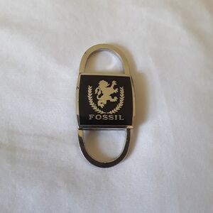 Vintage/Fossil keychain/black on silver/pull outs on top and bottom/2 1/2 inches